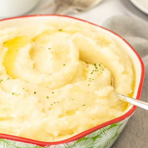 bowl of instant pot mashed potatoes with spoon in it