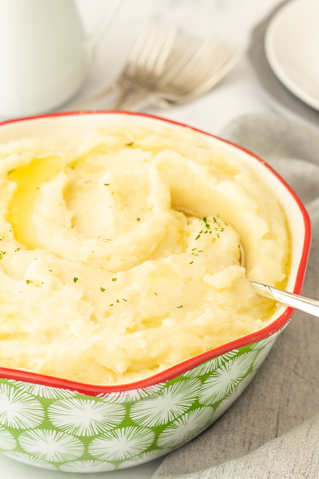 bowl of instant pot mashed potatoes with spoon in it