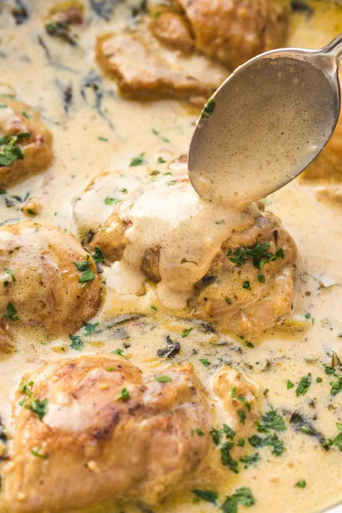 Spooning mustard gravy over chicken