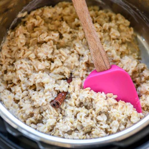 Instant pot inner pot with cooked oatmeal and spoon