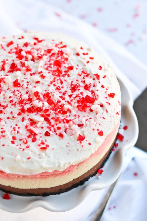 whole peppermint cheesecake with peppermint crushed bits on top