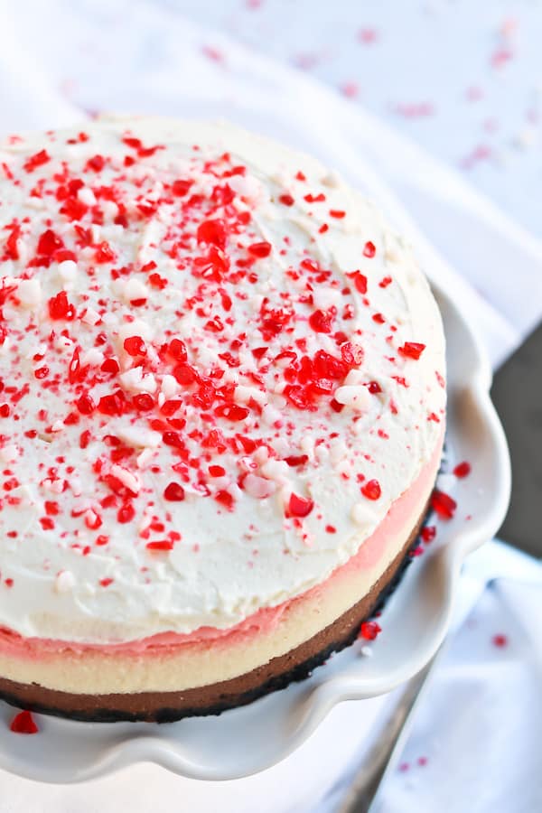 whole peppermint cheesecake with peppermint crushed bits on top