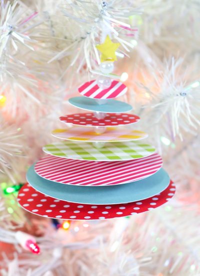 STacked circle tree ornament hanging on white christmas tree