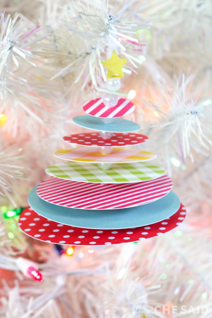 STacked circle tree ornament hanging on white christmas tree