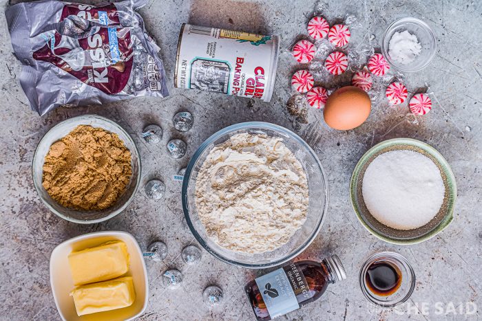 Peppermint Cookie Ingredients laid out on a grey marbled background.