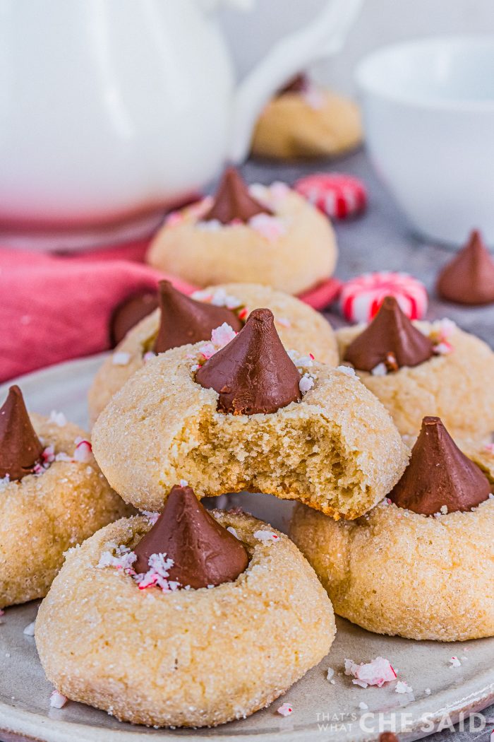 Close up of cookies on a plate with cookie with a bite out of it