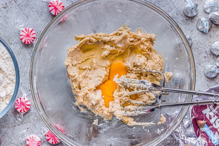 Adding eggs into the creamed butter