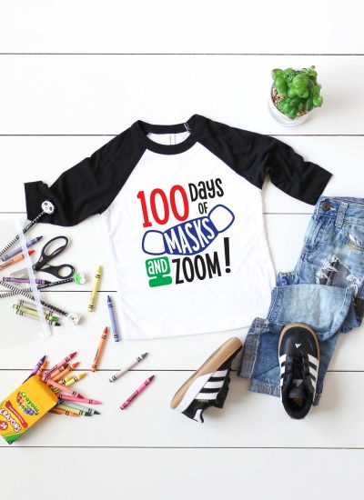 Vertical White background with black and white raglan t-shirt with 100 days of school design and school supplies