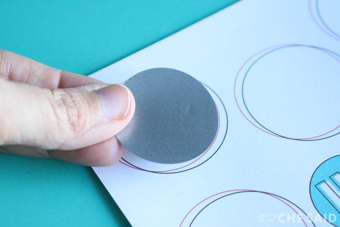 Placing the scratch off sticker on the printable