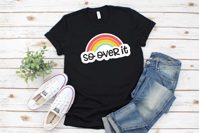 Black Tshirt with rainbow design, jeans and tennis shoes - horizontal shot