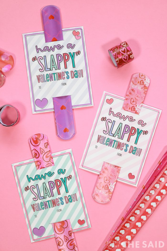 Free printable slap bracelet valentines on pink background with slap braclets