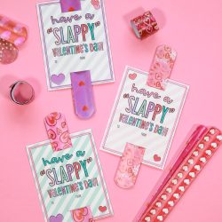 pink background with slap bracelets and printable valentines