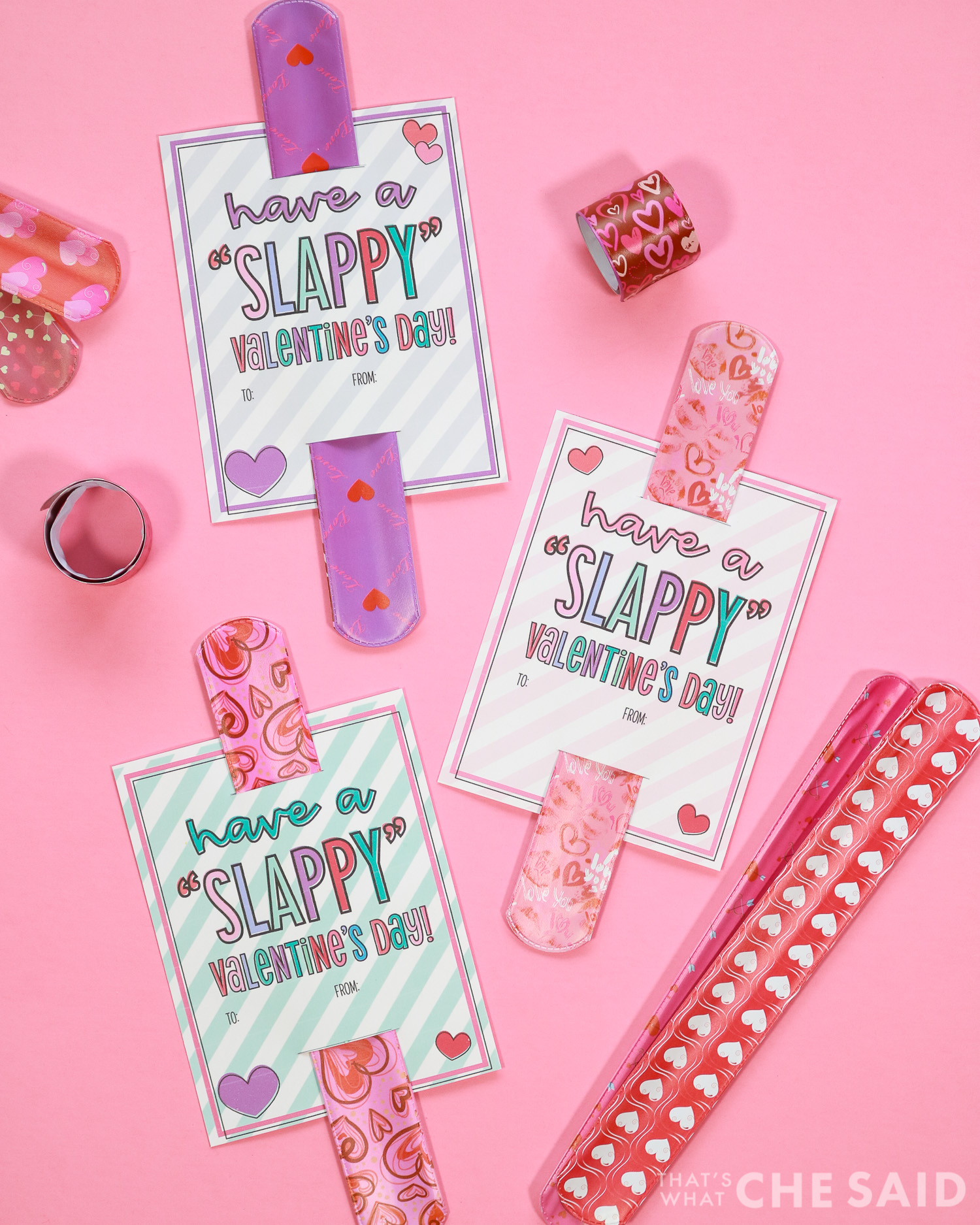 pink background with slap bracelets and printable valentines