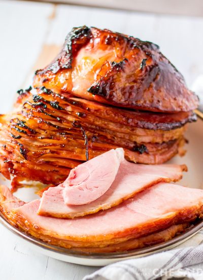 maple brown sugar sliced ham on a platter - vertical