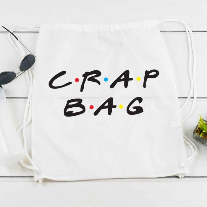 White draw string back pack with "Crap Bag" written in the FRIENDS tv show font applied with sublimation