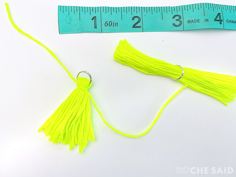 Embroidery thread tied around the thread bundle and jump ring to make a tassel earring
