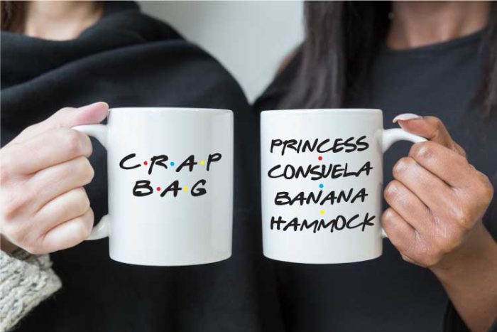 Two people holding coffee mugs that read FRIENDS tv show quotes