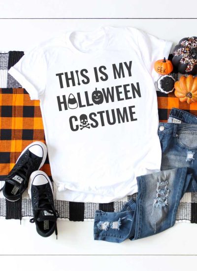 White shirt on plaid runner with jeans and t-shirt and Halloween saying on T-shirt