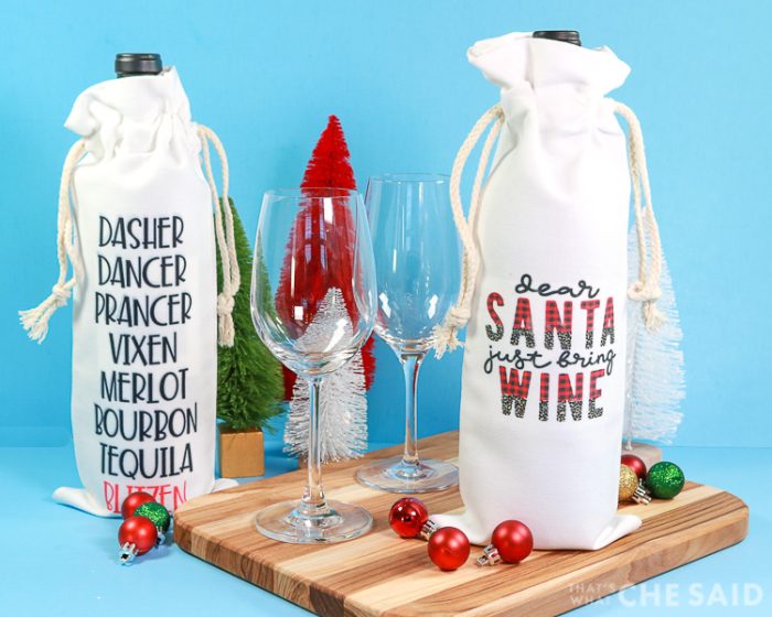 Two wine bottle bags sublimated for Christmas with wine glasses and christmas trees and ornaments