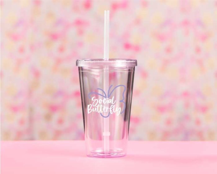 Pink Tumbler on Pink background with Social Butterfly SVG Design in Vinyl
