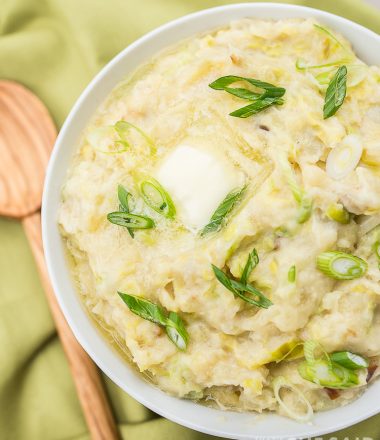 Instant Pot Irish Colcannon in a bowl with green napkin and wooden spoon - featured image