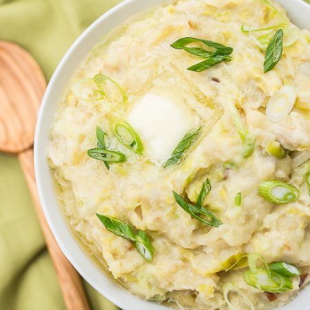 Instant Pot Irish Colcannon in a bowl with green napkin and wooden spoon - featured image