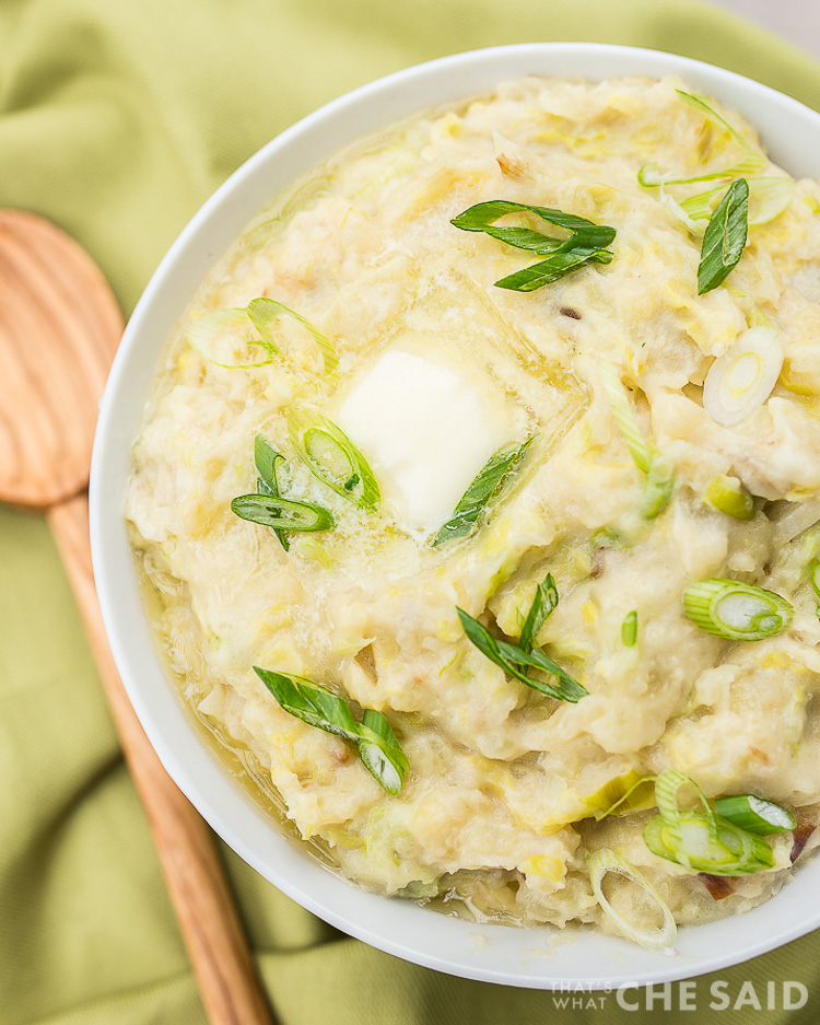 Instant Pot Irish Colcannon in a bowl with green napkin and wooden spoon - featured image