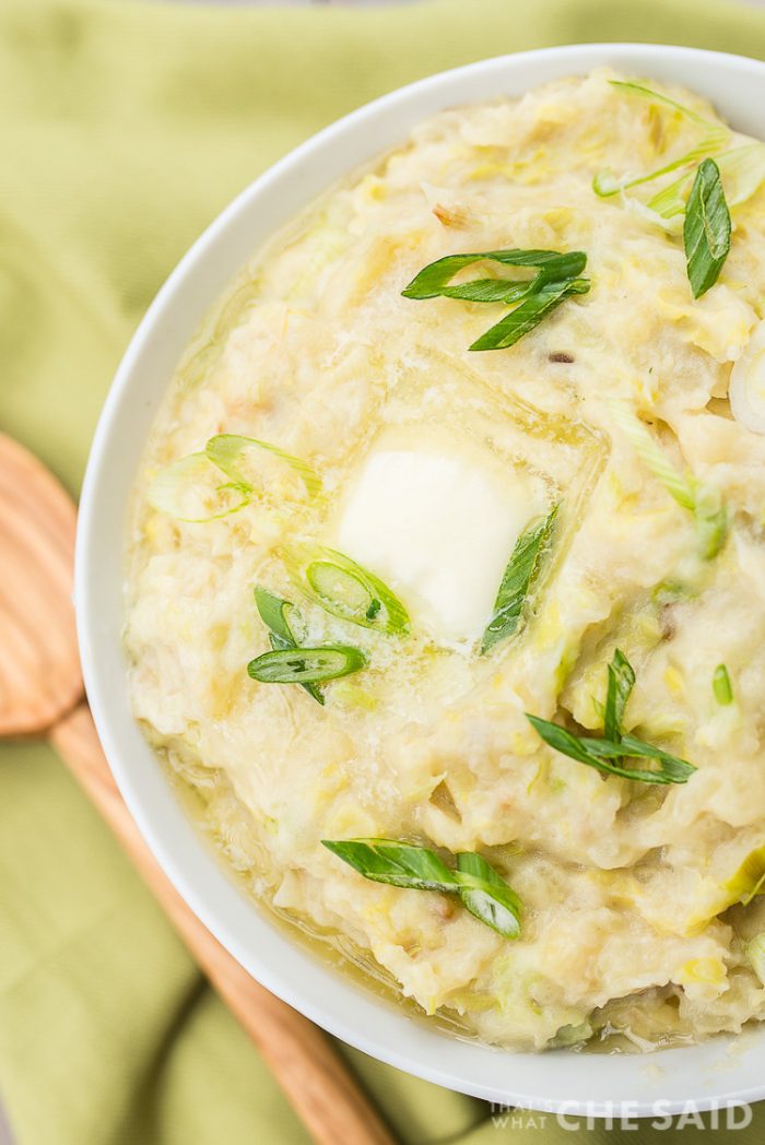 green napkin and bowl of Irish Colcannon with wooden spoon