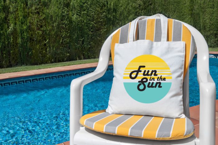 Pool with pool chair and white tote on the chair with fun in the sun