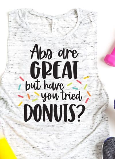 work out tank with donut saying and weights and shoes and water bottle.
