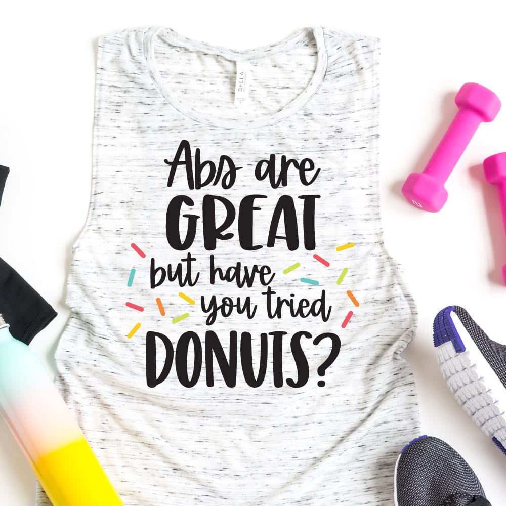 work out tank with donut saying and weights and shoes and water bottle.