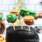 Cauldron Cake Pops with Orange and Green icing