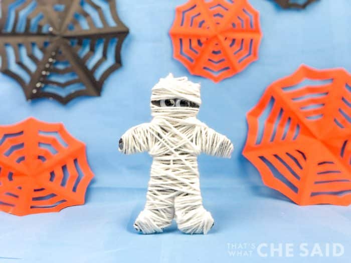 Halloween Kids craft - yarn mummy on blue background