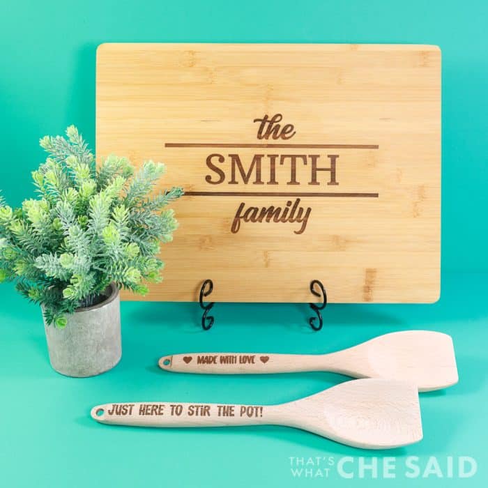 engraved bamboo cutting board and mixing spoons