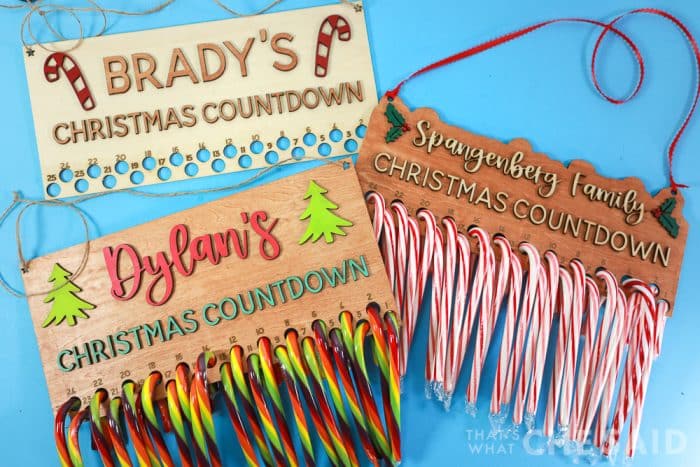 Three Candy Cane Countdowns cut from laser, added candy canes on blue background
