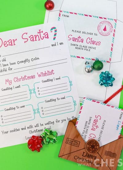 Free Printable Christmas Wishlist with envelope on green backdrop with laser engraved ornament square