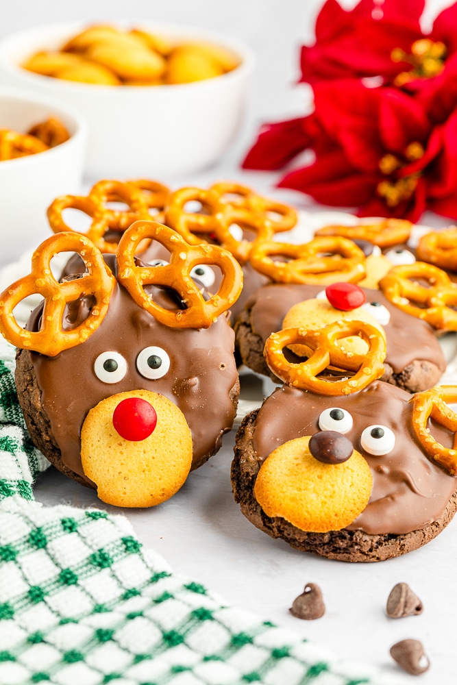 Reindeer Cookies made form cake mix on a white platter with christmas towel.