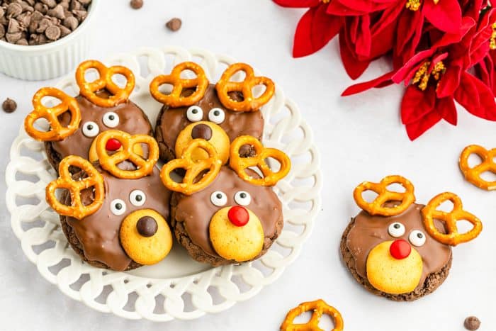 Reindeer cake mix cookies on a white platter with chistmas decor in background