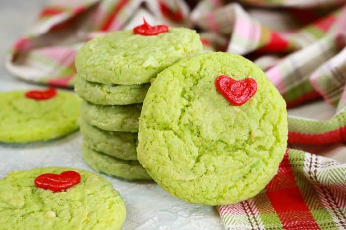 Green Cake Mix cookies stacked with red icing heart