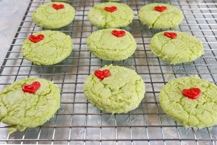 cake mix grinch cookies on a wire cooling rack