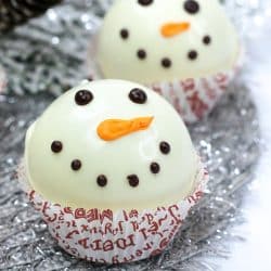 Close up of completed snowman hot cocoa bomb in a cupcake liner