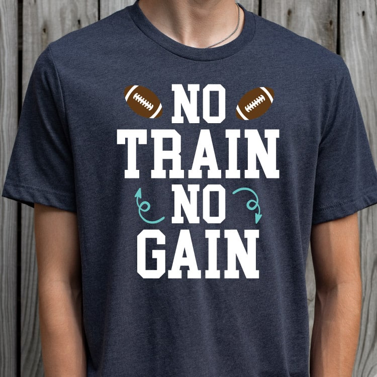 Man wearing navy tshirt with "No train, no gain" design with footballs - square orientation