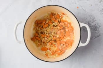 Cooked carrots and onions in cast iron dutch oven