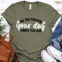 Green tshirt with "Be the person your dog things you are" in iron on