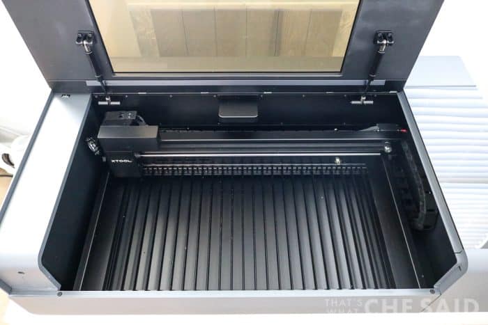 View inside the xtool P2 laser cutter with lid lifted and slats in tact