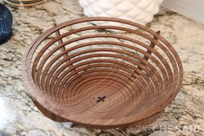 Walnut bowl made from xtool P2 laser cutter sitting on kitchen counter empty close up