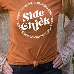 woman wearing an Autumn Orange T-shirt with the Side Chick design in white iron-on in vertical format