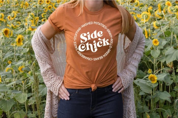 woman wearing an Autumn Orange T-shirt with the Side Chick design in white iron-on in horizontal format