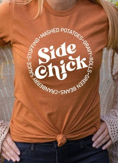 woman wearing an Autumn Orange T-shirt with the Side Chick design in white iron-on in square format
