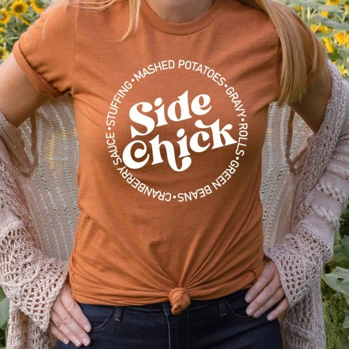 woman wearing an Autumn Orange T-shirt with the Side Chick design in white iron-on in square format